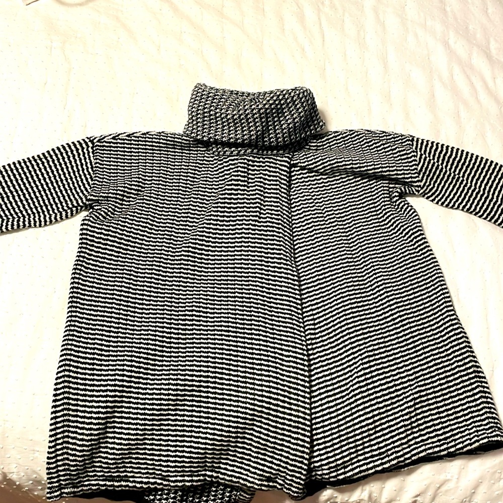 Black and white knit turtle neck sweater